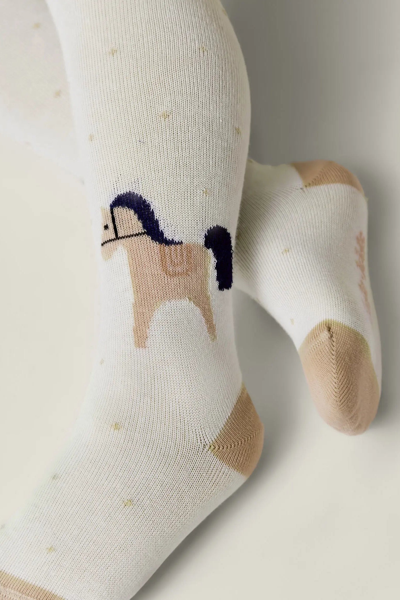 Children's socks with a horse design on a light background #color_milky
