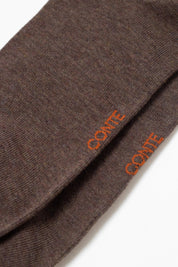 Brown fabric with 'Conte' branding on a white background  #color_brown