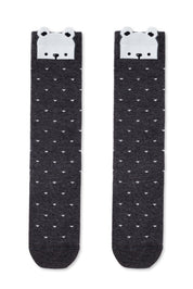 Pair of black socks with white bear faces on a white background