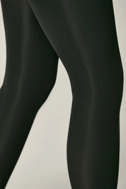 Black tights on a plain background #color_nero-black