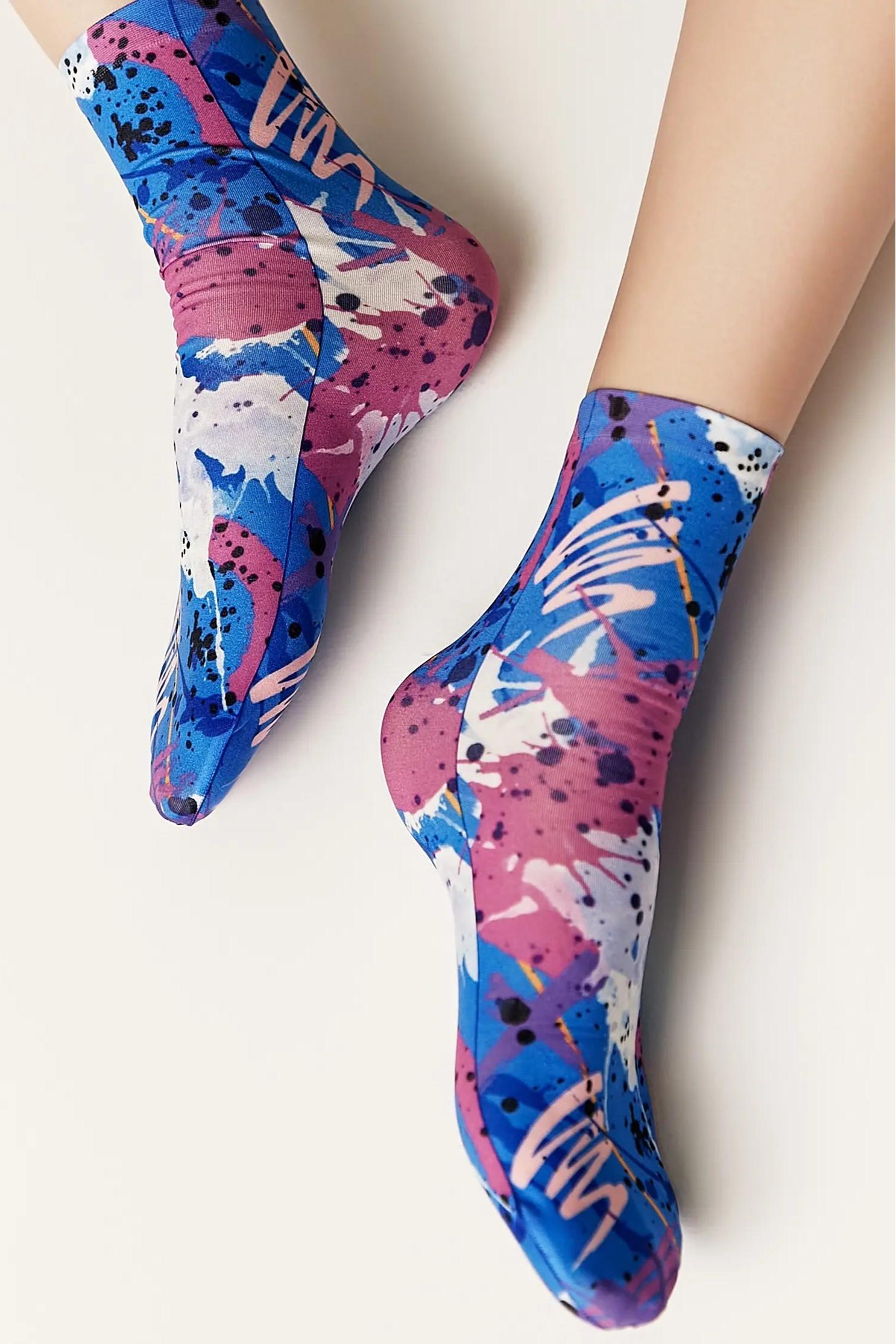 Colorful abstract-patterned socks on a white background