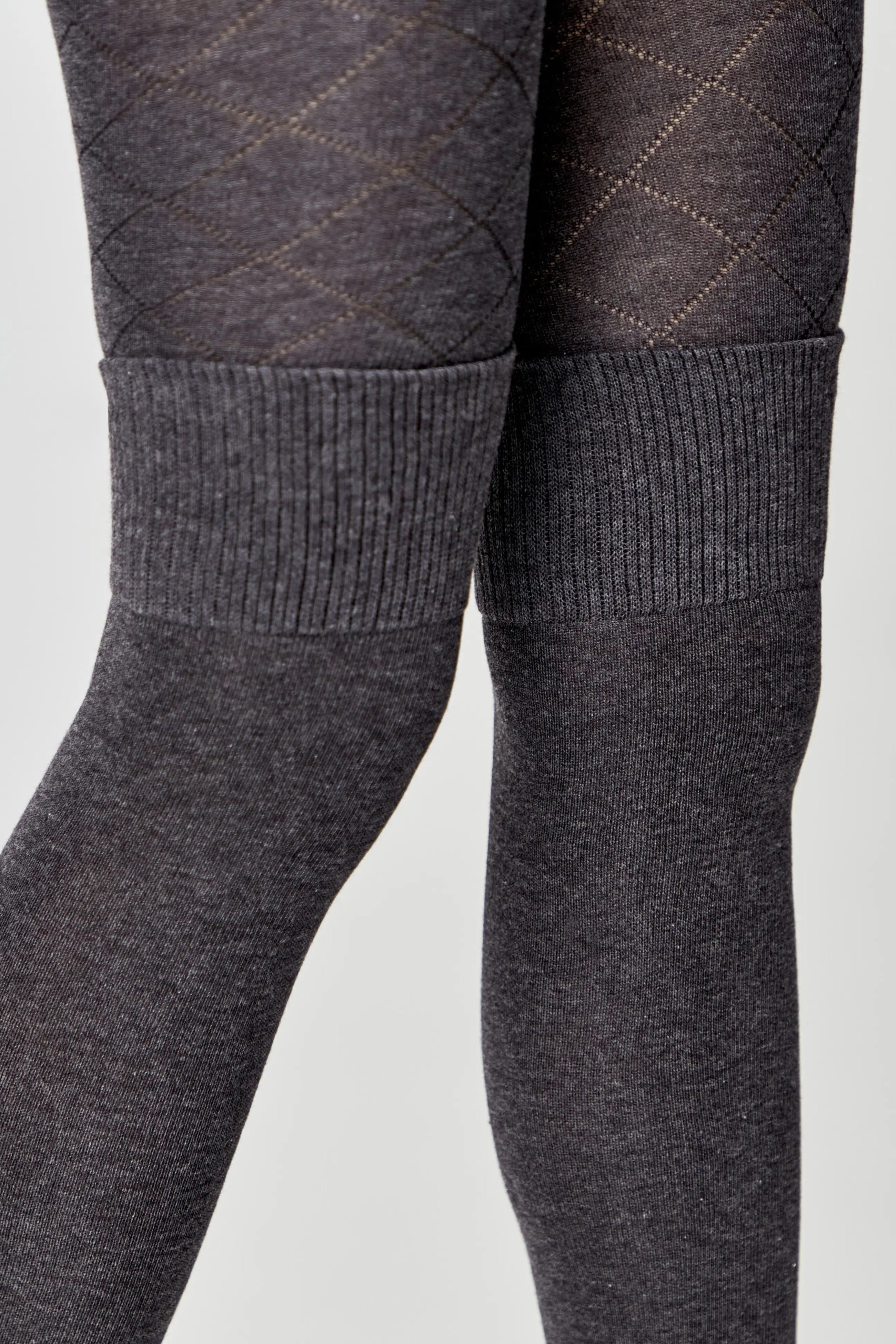 Dark gray tights with textured pattern on a light gray background #color_dark-gray