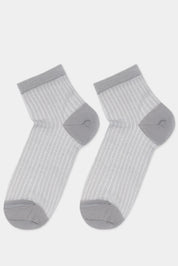 Pair of gray socks with ribbed texture on a light gray background #color_gray