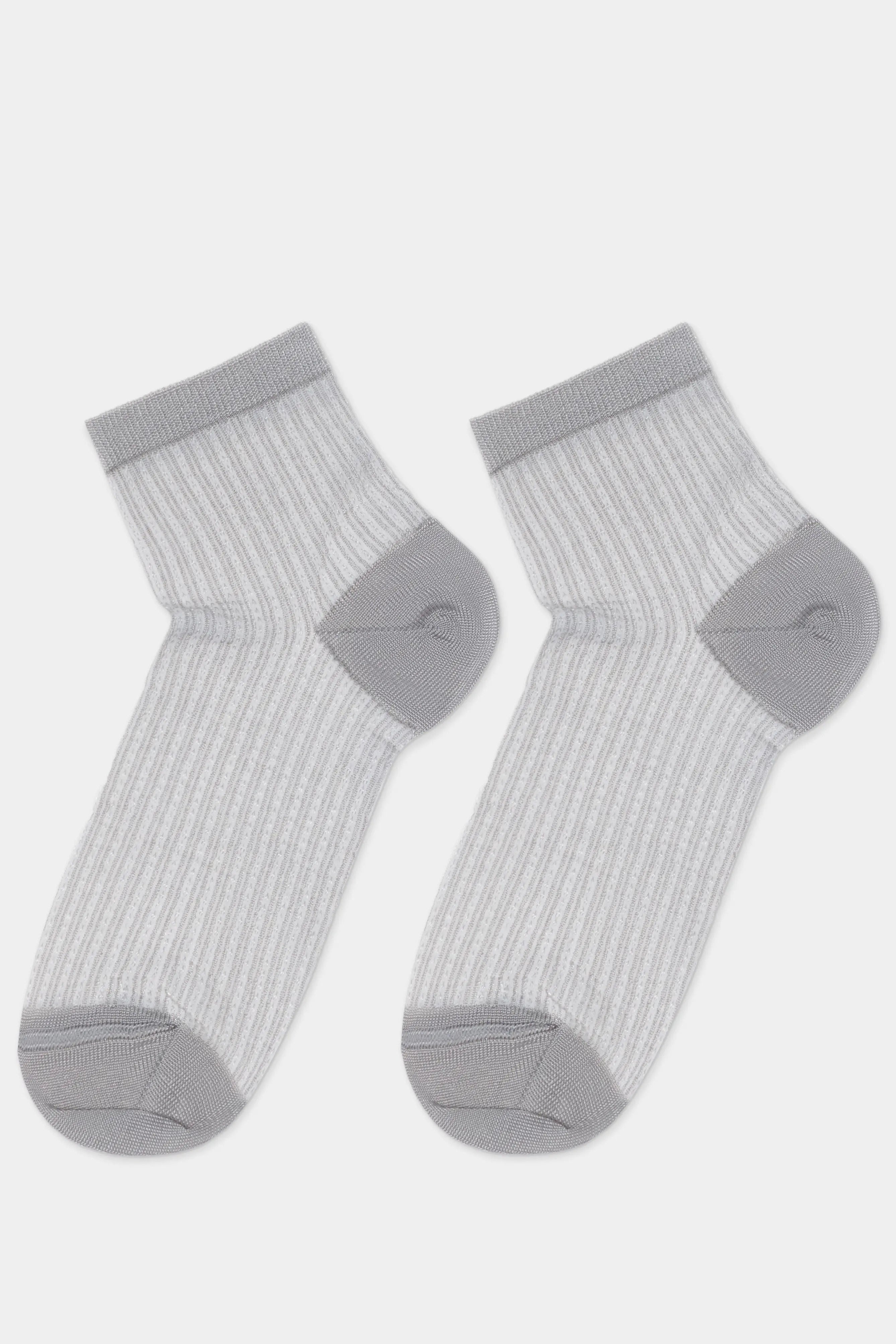 Pair of gray socks with ribbed texture on a light gray background #color_gray