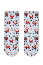 Two socks with Santa Claus pattern on a light blue background