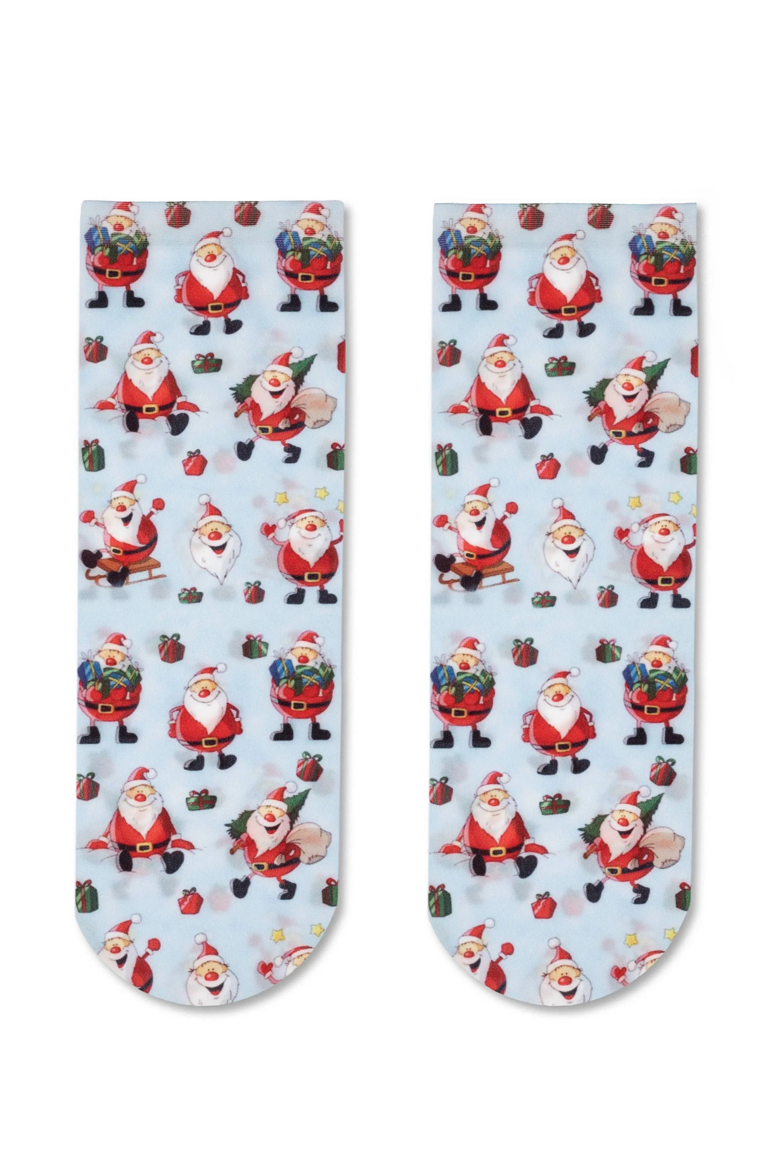 Two socks with Santa Claus pattern on a light blue background