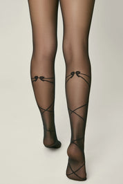 Black sheer stockings with decorative bows on a neutral background #color_nero-black