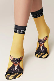 Yellow socks with dog print and 'Style' text on a neutral background