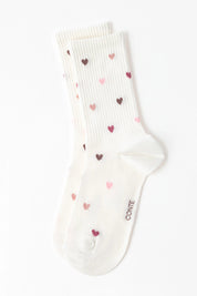 White sock with heart patterns on a white background #color_milky
