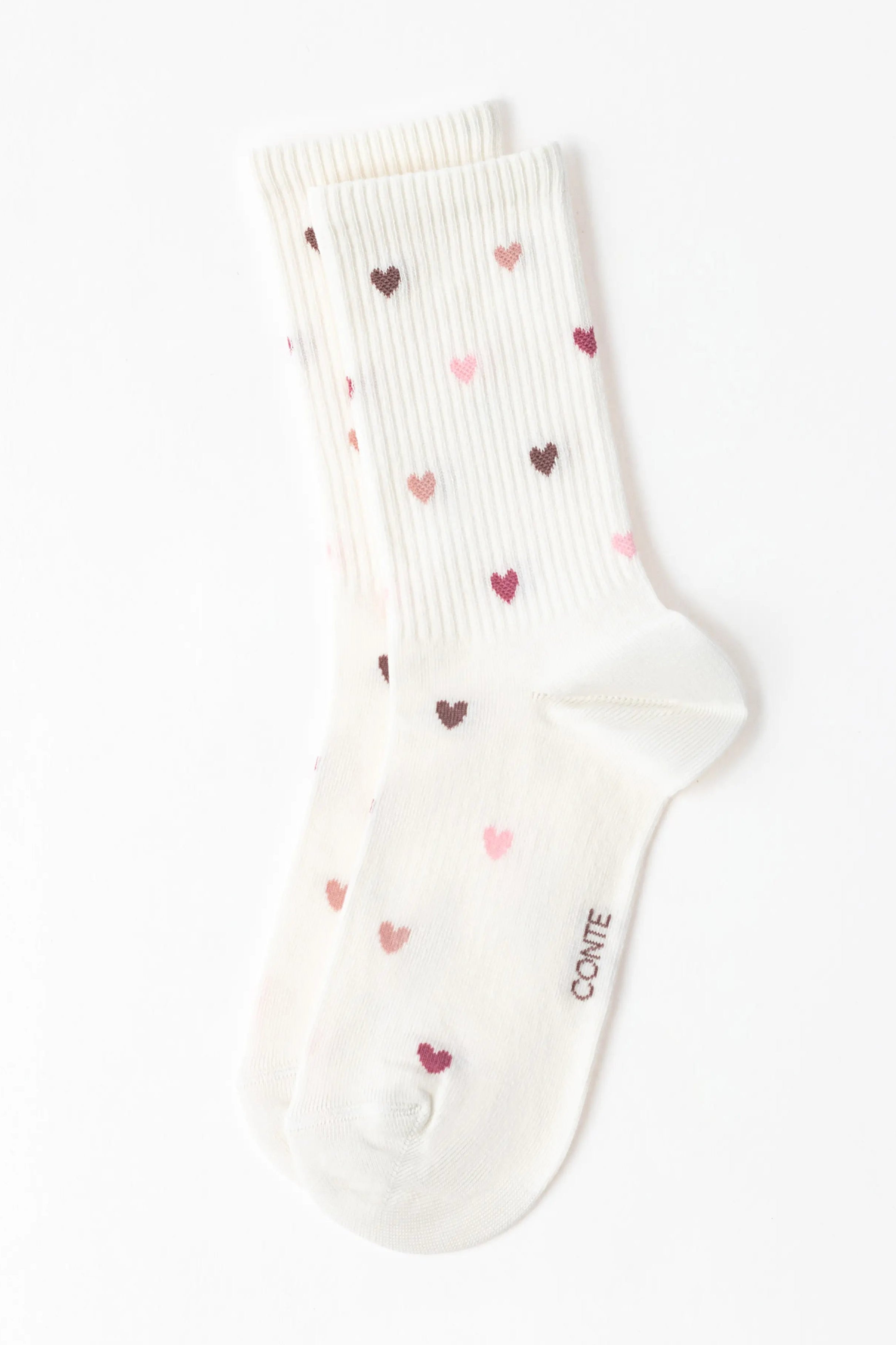 White sock with heart patterns on a white background #color_milky