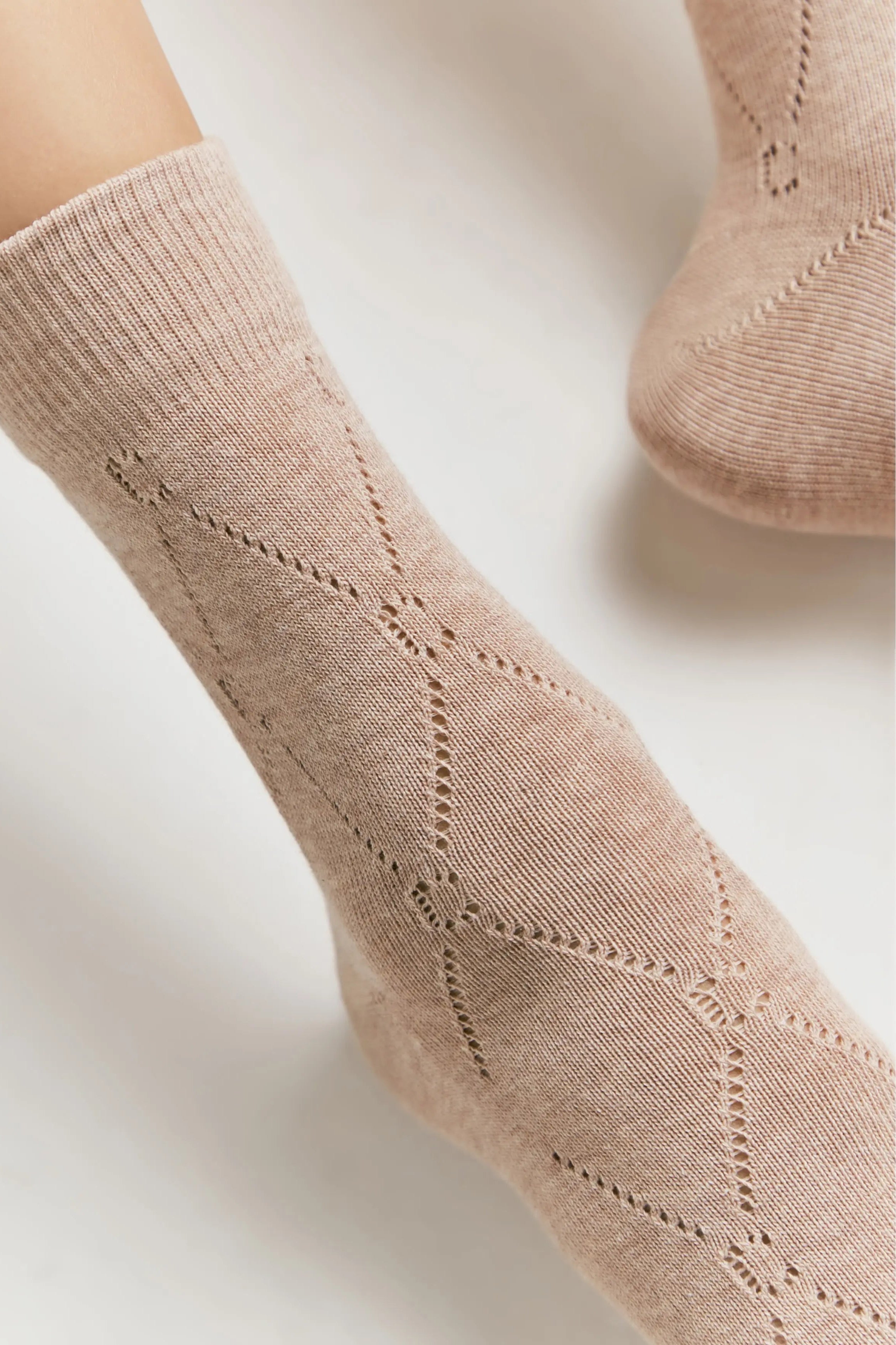 Beige sock on a white background #color_beige