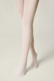 Beige tights worn by a person on a plain background #color_bianco