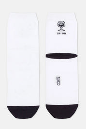 White socks with black accents and branding on a white background