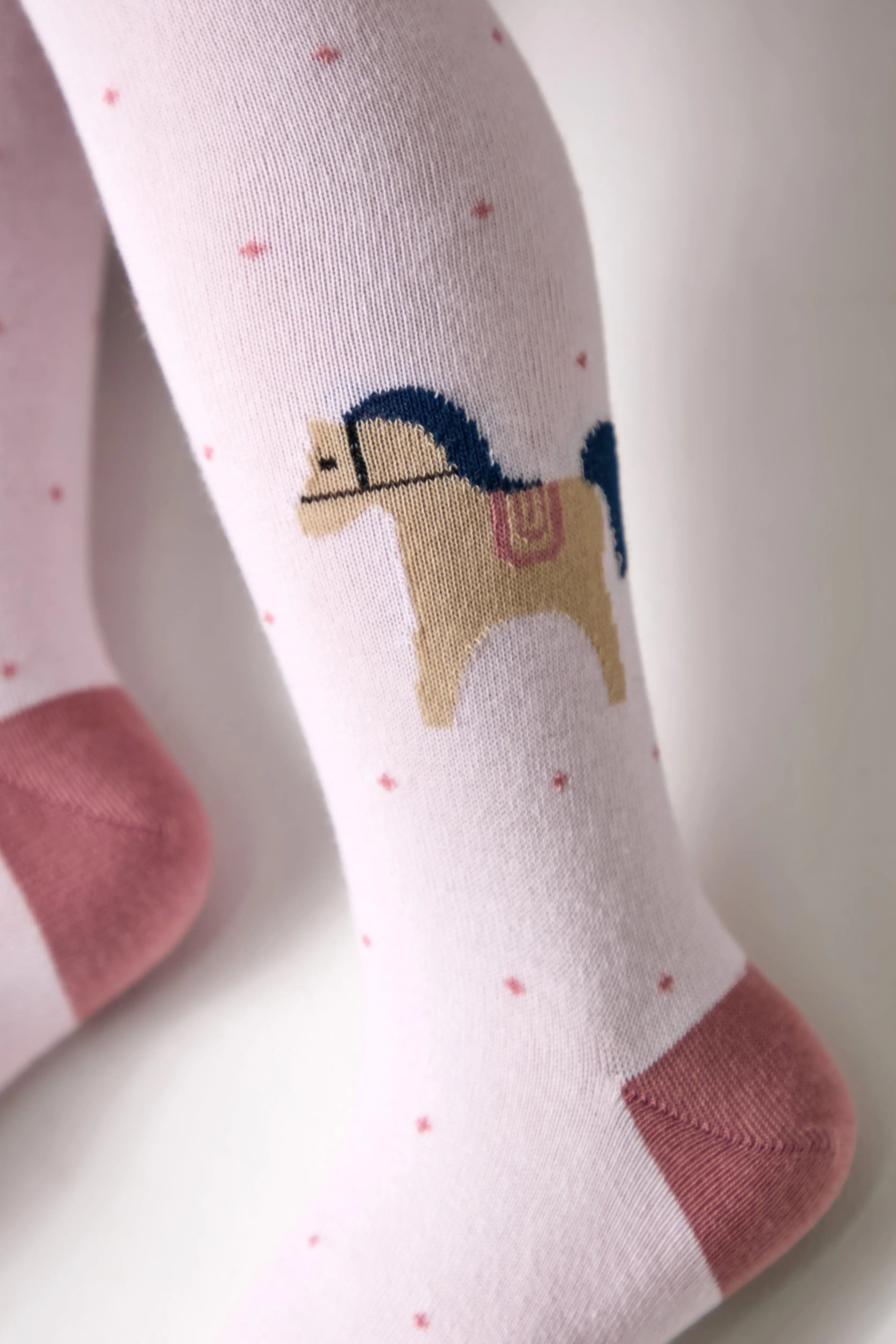 Children's tights with a horse design on a light background #color_light-pink