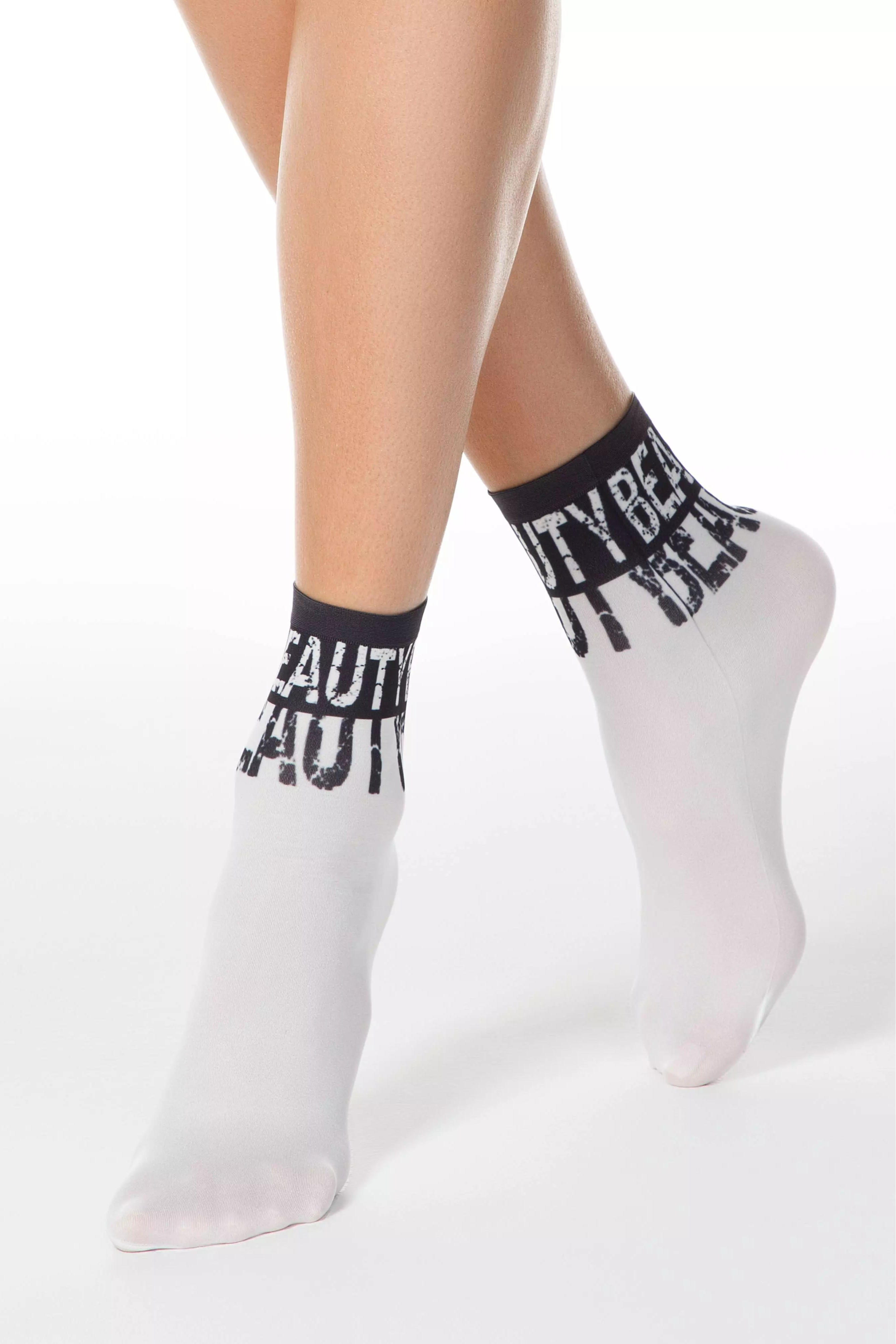 White socks with black text worn by a person on a white background