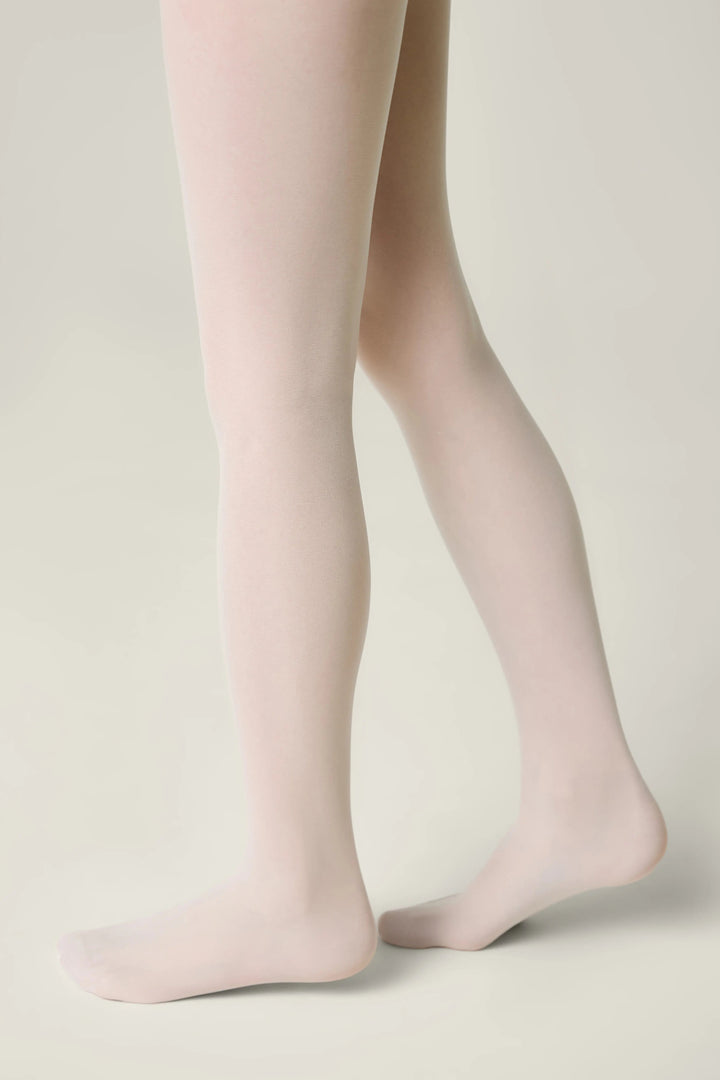 Light pink tights worn by a person on a neutral background #color_bianco