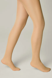 Beige tights worn by a person on a plain background #color_natural-nude