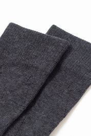 Pair of dark gray socks on a white background #color_dark-gray