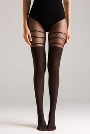 Black sheer stockings with thin straps worn by a person on a plain background #color_grafit
