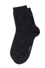 Black sock with geometric pattern on a white background #color_black