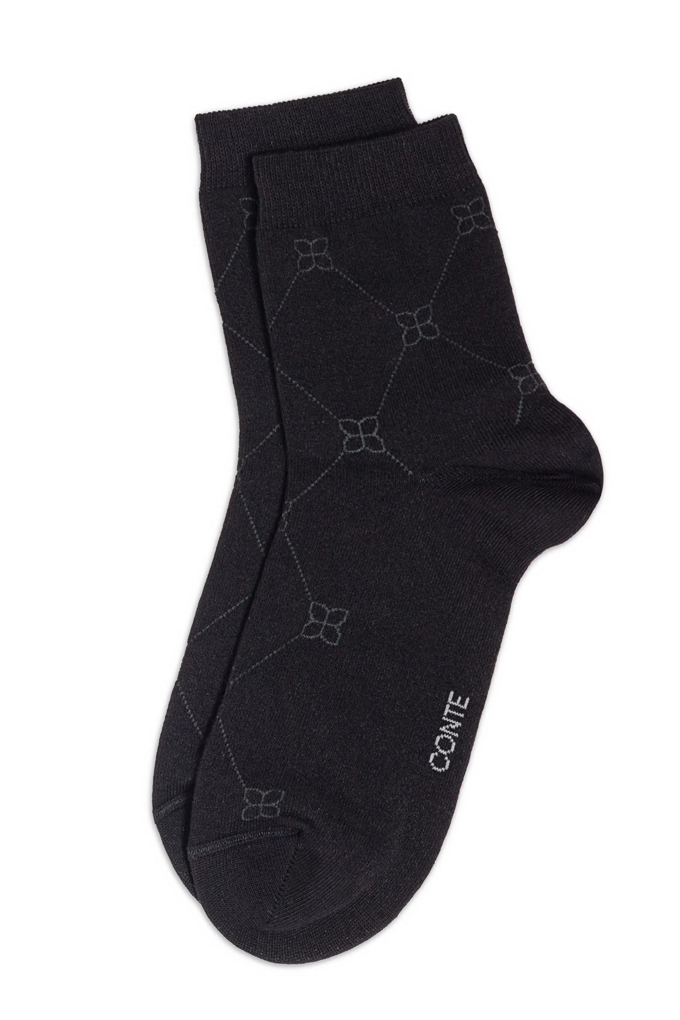 Black sock with geometric pattern on a white background #color_black