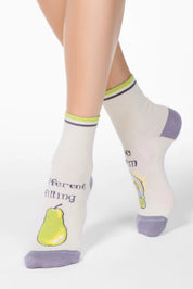 White socks with pear design and text worn by a person on a white background