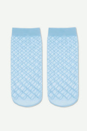 Pair of light blue textured socks on a white background #color_light-blue