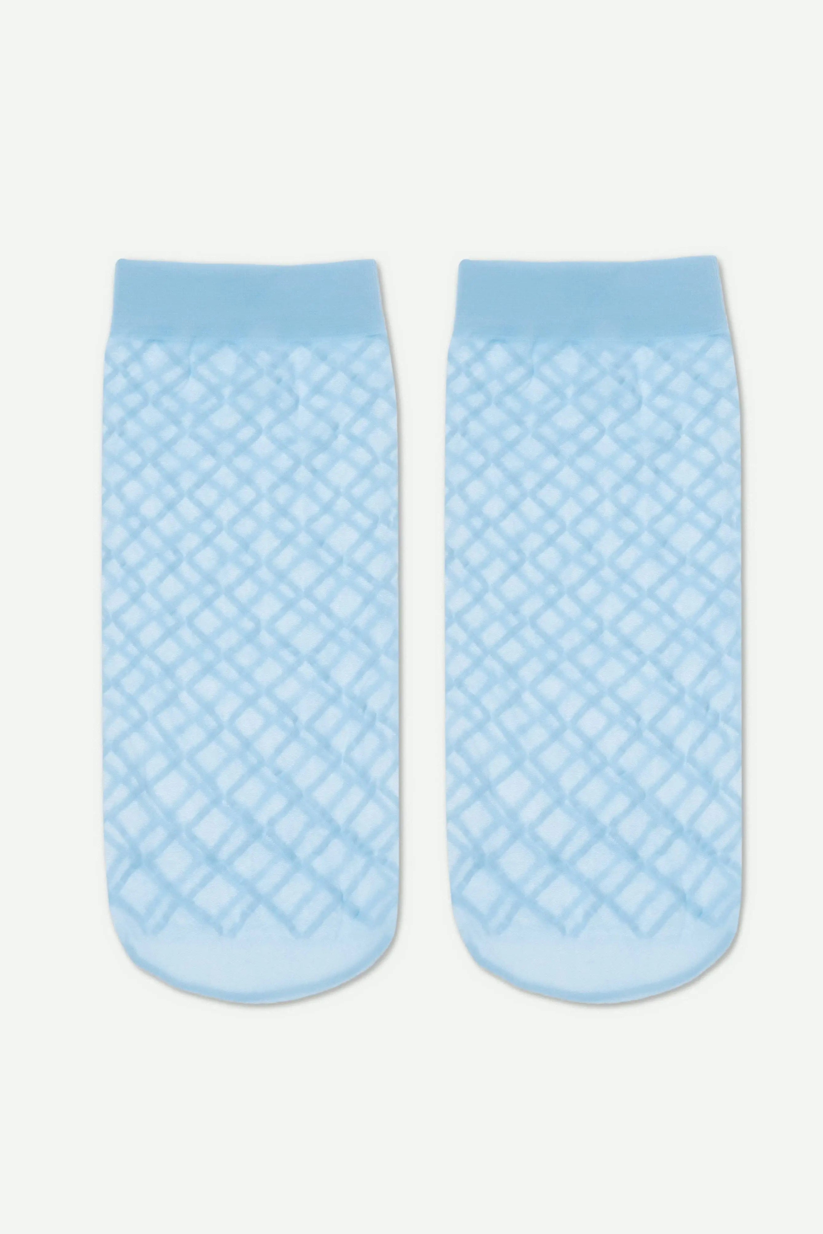 Pair of light blue textured socks on a white background #color_light-blue