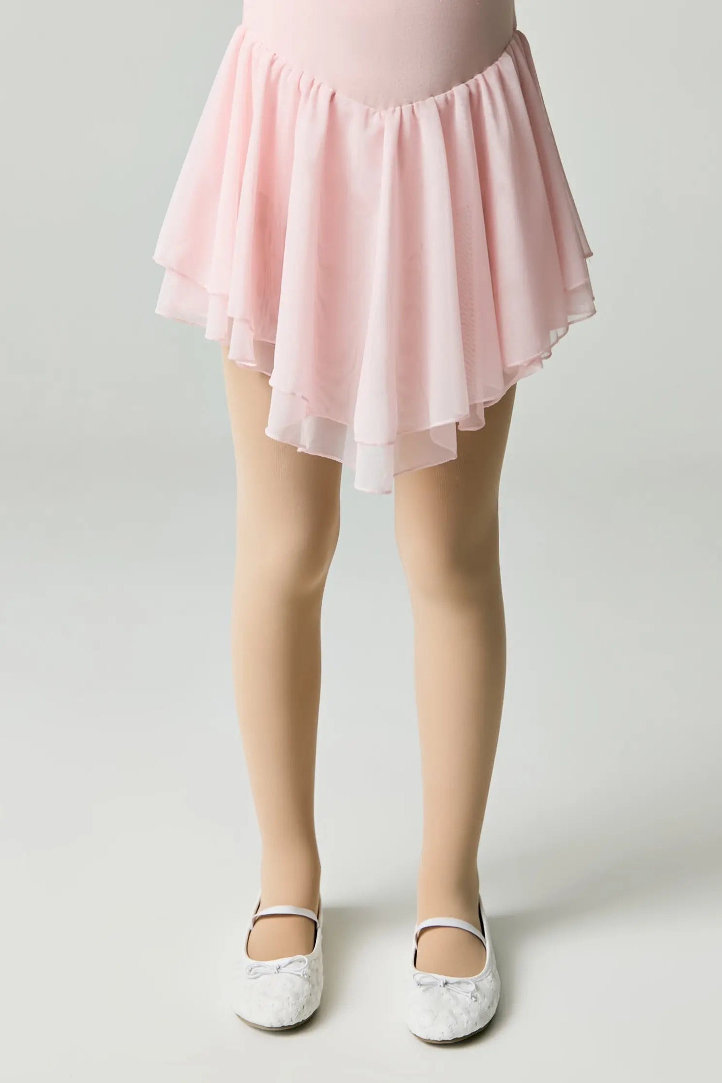 Person wearing a pink skirt on a plain background #color_natural-nude