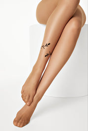 Legs with a subtle tattoo on a white background