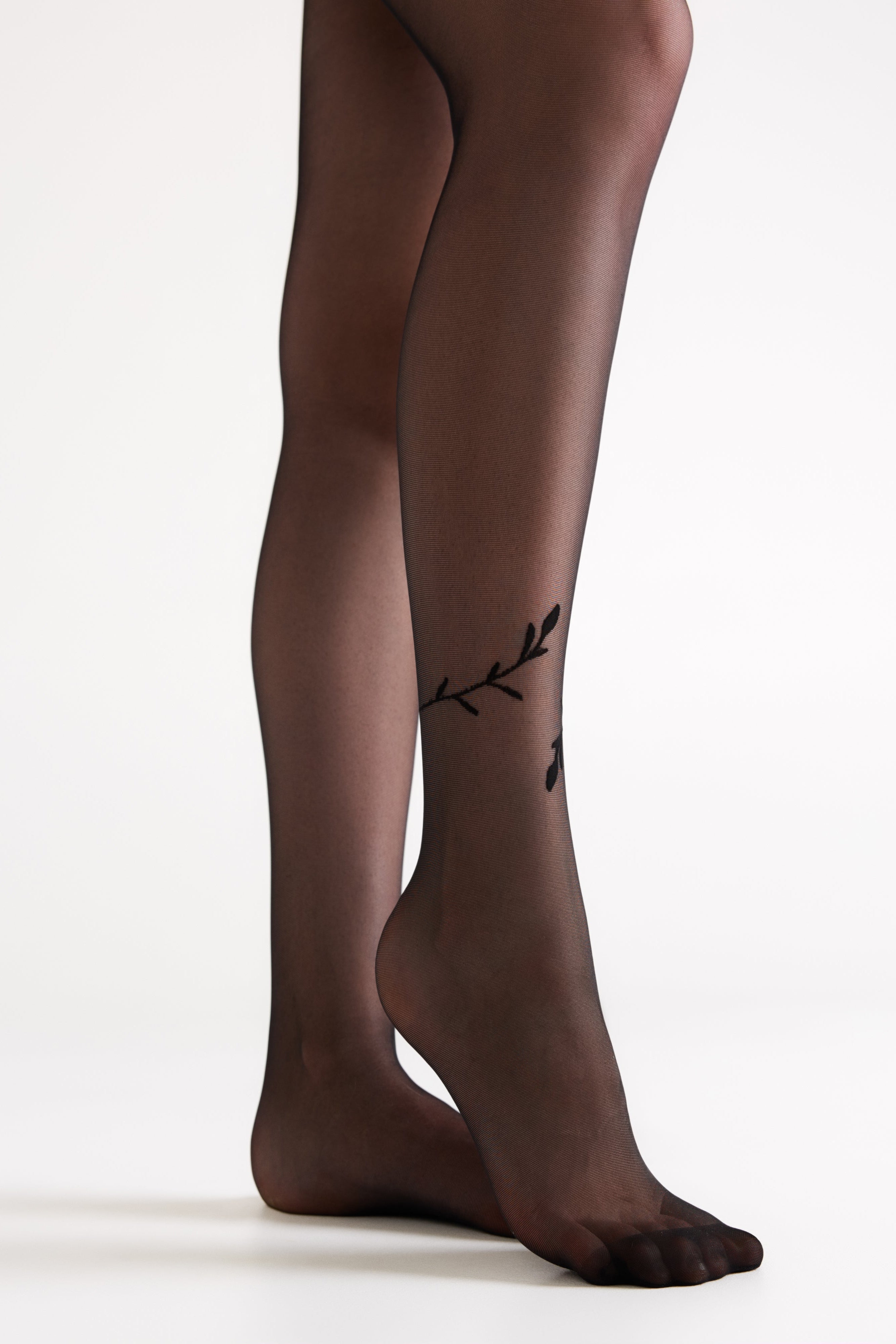 Black tights with a subtle design on a white background