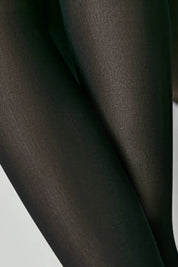 Close-up of dark brown tights on a light gray background #color_nero-black