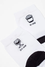 White socks with black icons and text on a white background
