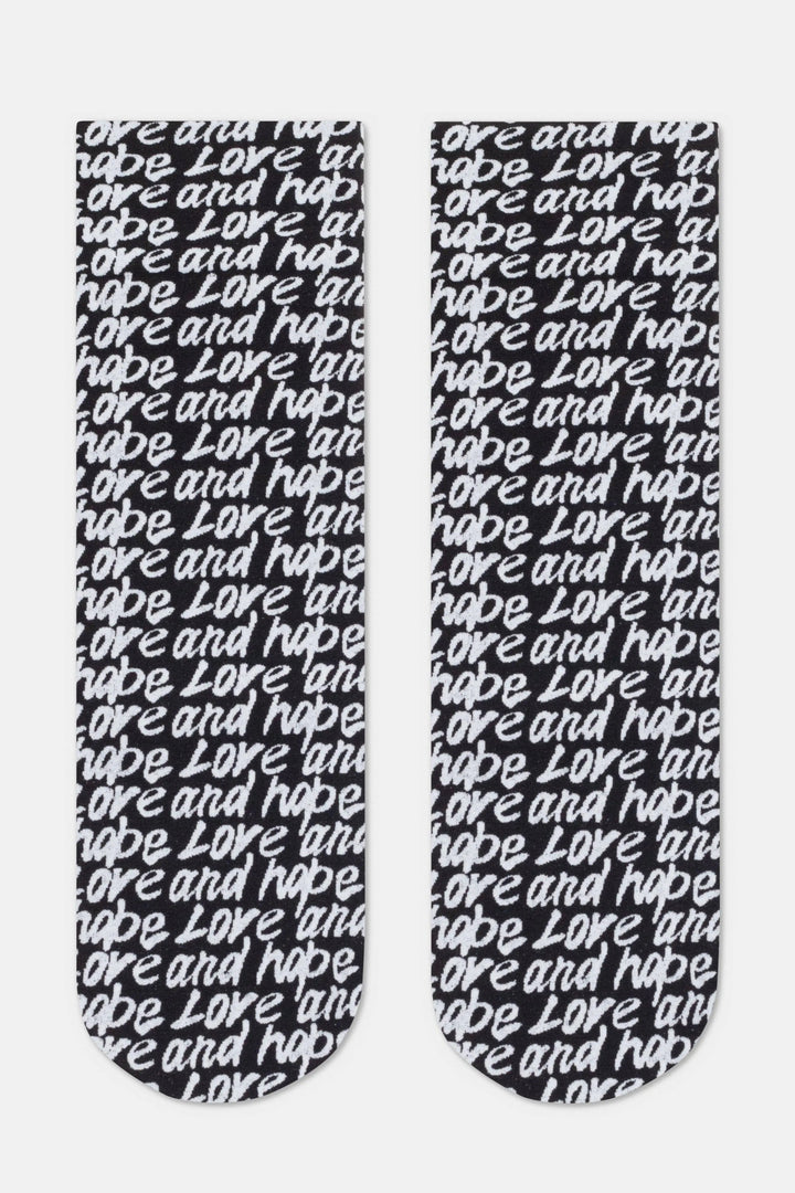 Black socks with 'love and hope' text on a white background #color_nero-bianco