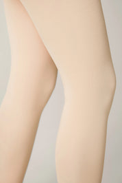 Beige tights worn by a person on a light gray background #color_pink-ballet
