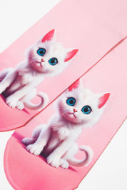 Pink slippers with white cat designs on a pink background