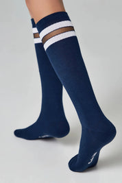 Navy knee-high socks with white and brown stripes on a light gray  background #color_dark-blue