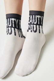 White socks with black text on a white background