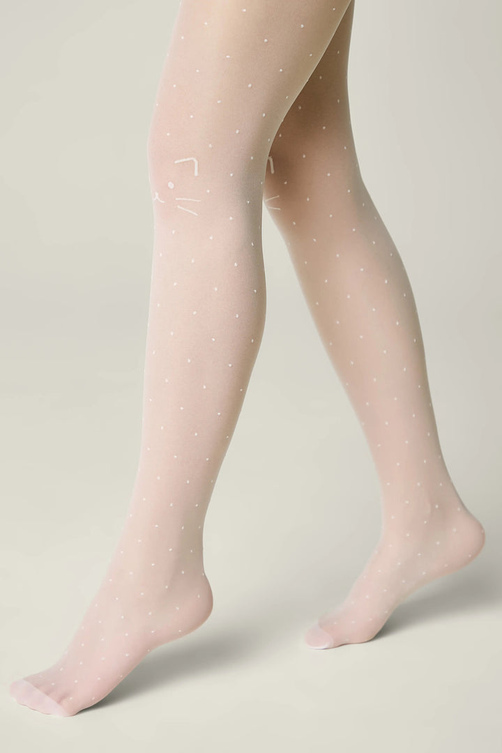 Sheer tights with white polka dots worn by a person on a neutral background #color_bianco