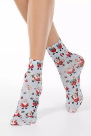 Socks with Santa Claus pattern worn by a person on a white background