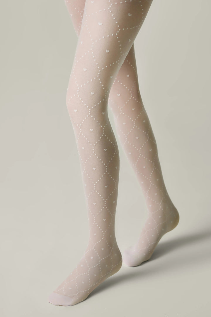 Light pink tights with subtle pattern worn by a person on a neutral background #color_bianco
