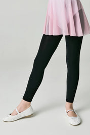 Person wearing black leggings and a pink skirt on a plain background #color_nero-black
