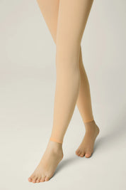 Beige tights worn by a person on a plain background #color_natural-nude