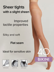 A model's lower body wearing sheer beige-brown bikini tights against a light gray background, with text highlighting features like 'Sheer tights with a slight sheen' and 'Improved tactile properties'.