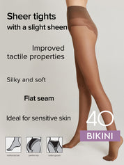 A model's legs wearing sheer brown bikini-style tights against a light gray background, with text highlighting features like 'Sheer tights with a slight sheen' and 'Improved tactile properties'.