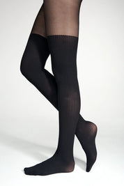 Black knee-high socks worn by a person on a white background