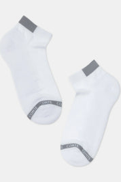 Two white socks with gray accents on a light gray background #color_white