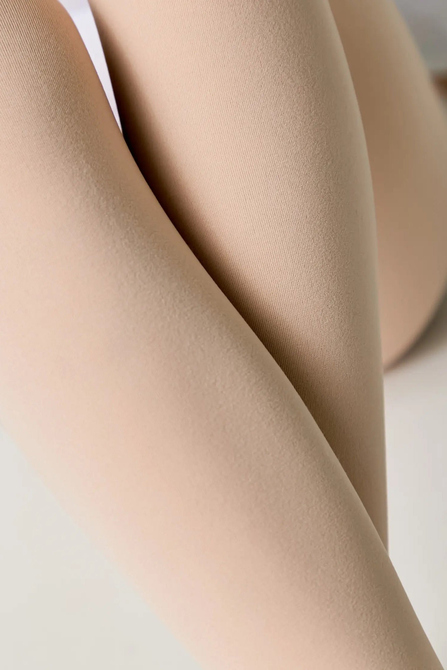 Close-up of beige tights on a light background #color_pink-ballet