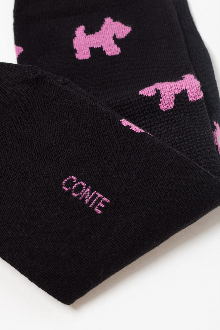 Black socks with pink dog patterns and 'Conte' branding on a white background  #color_black