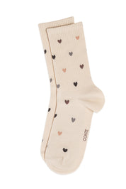 Beige sock with heart patterns on a white background #color_beige